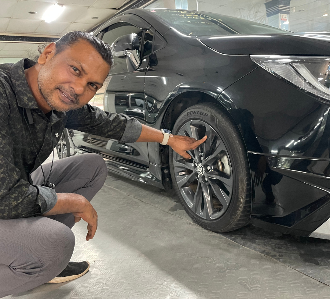 Toyota Corolla Touring, white color, sleek exterior, modern design, station wagon, alloy wheels, LED headlights, fuel-efficient, spacious interior, Japanese reconditioned car, perfect for family or ride-sharing.